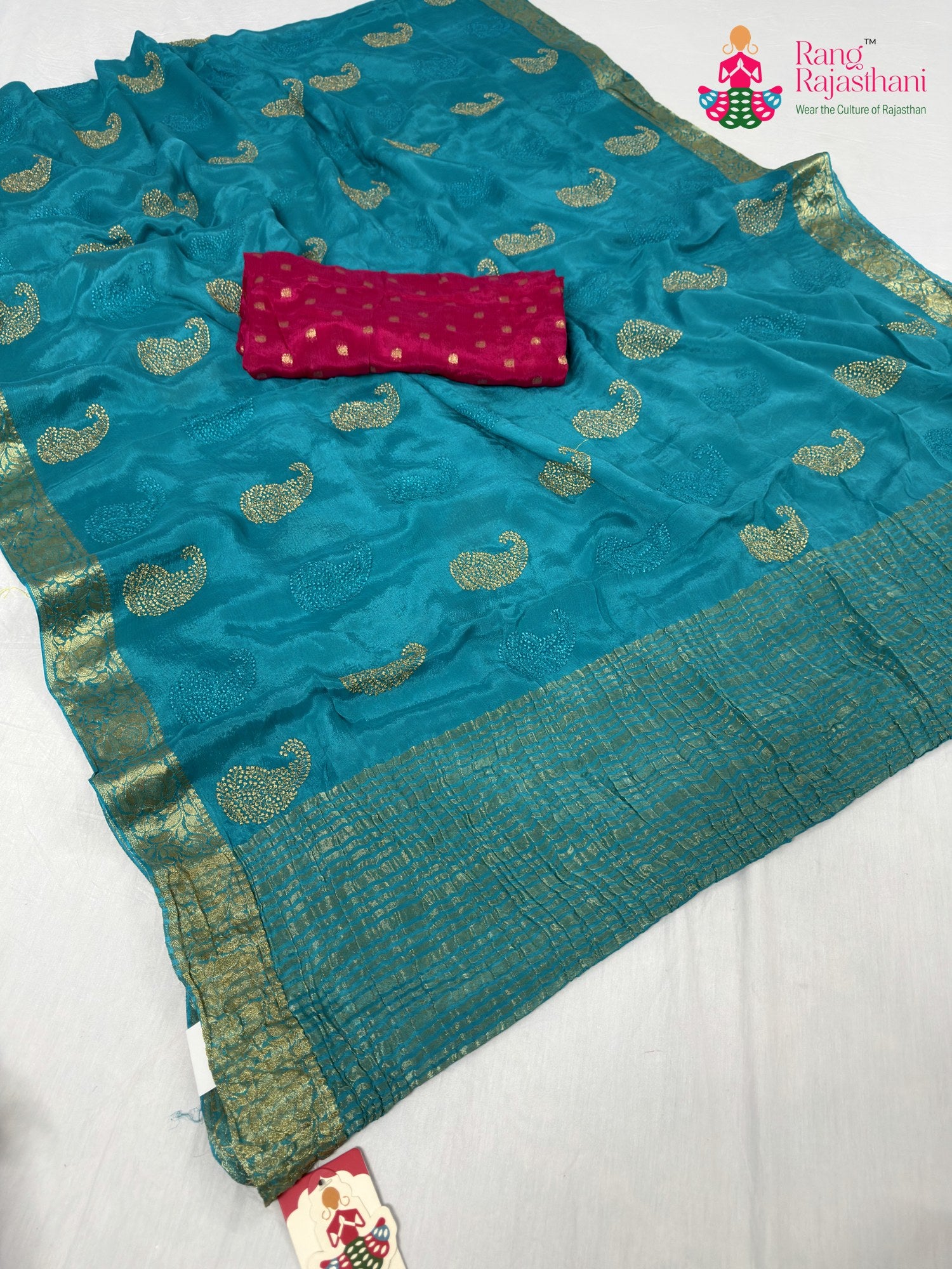 pallu detailing of firozi chinnon zari embroidery saree