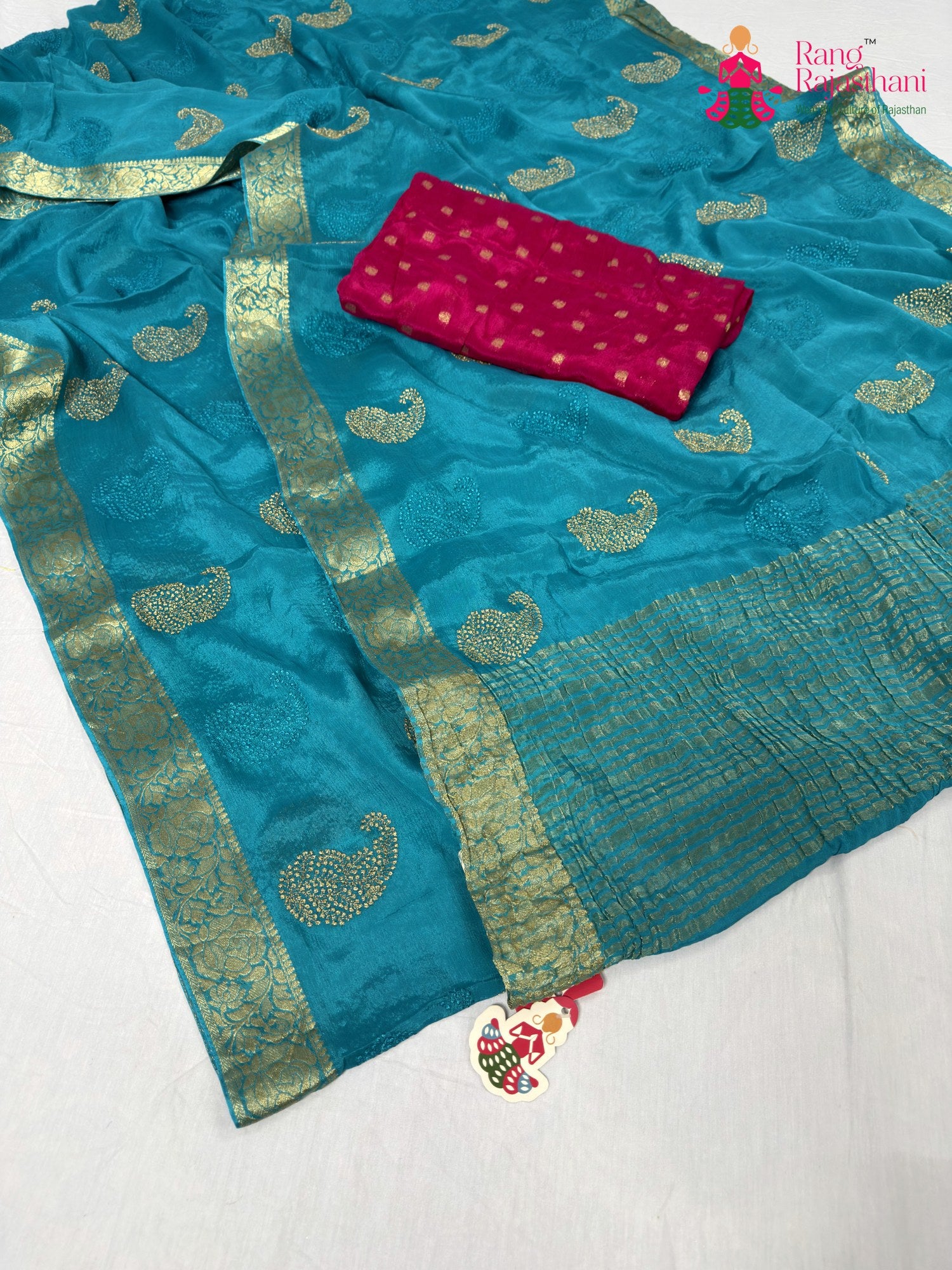 close up detailing of firozi chinnon zari embroidery saree