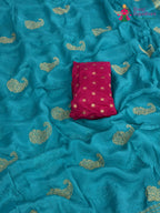 design pattern of firozi chinnon zari embroidery saree