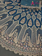 lehenga flare detailing of firozi net zari embroidery saree