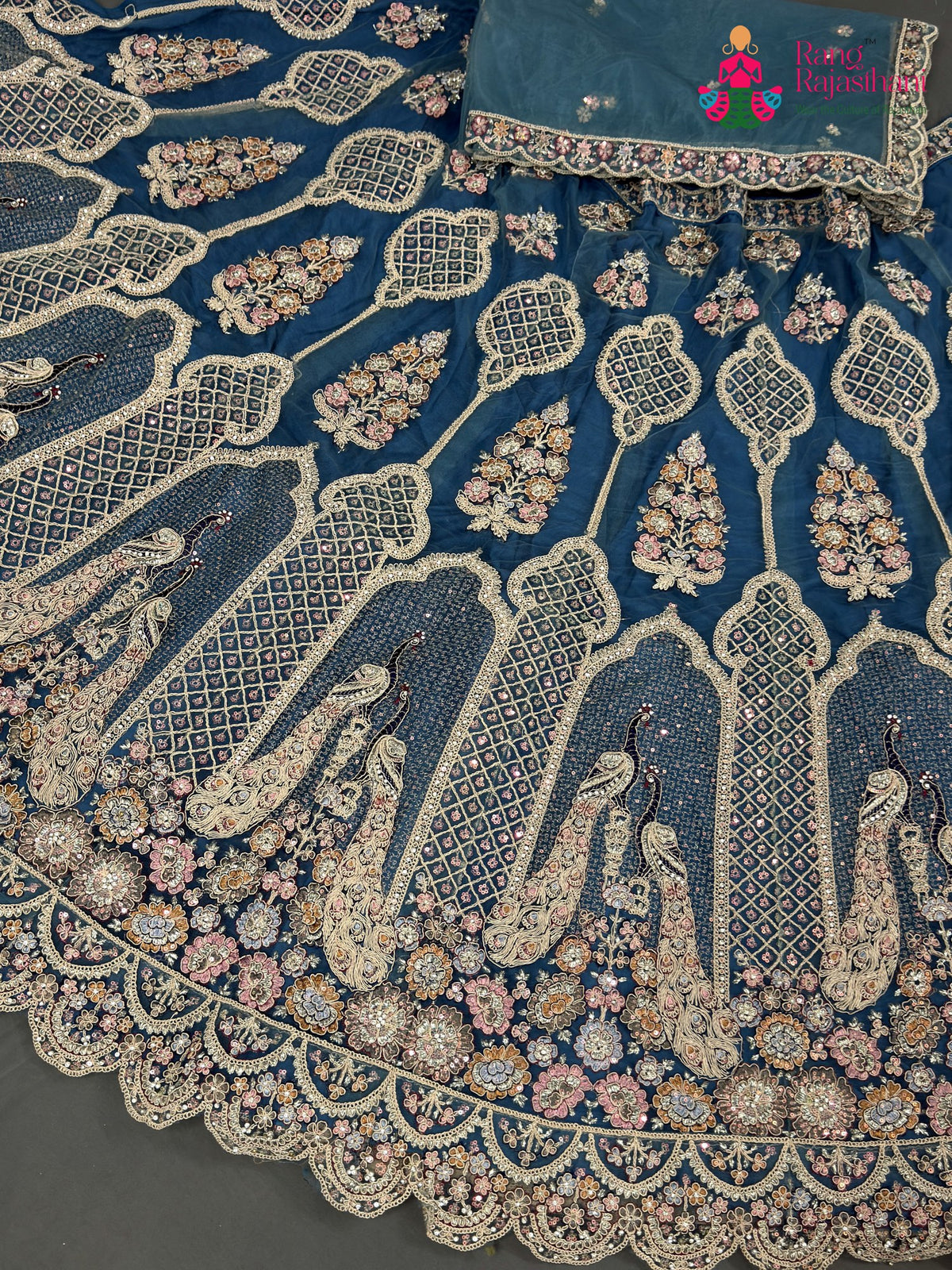 lehenga flare detailing of firozi net zari embroidery saree
