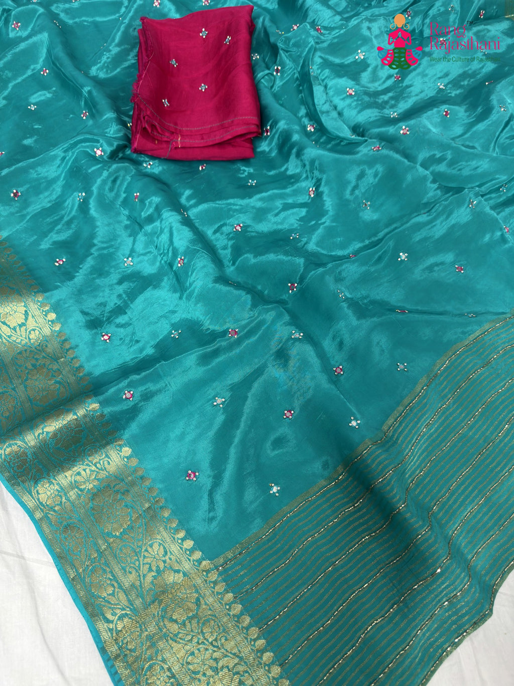 fabric texture of firozi pure ho silk mirror saree