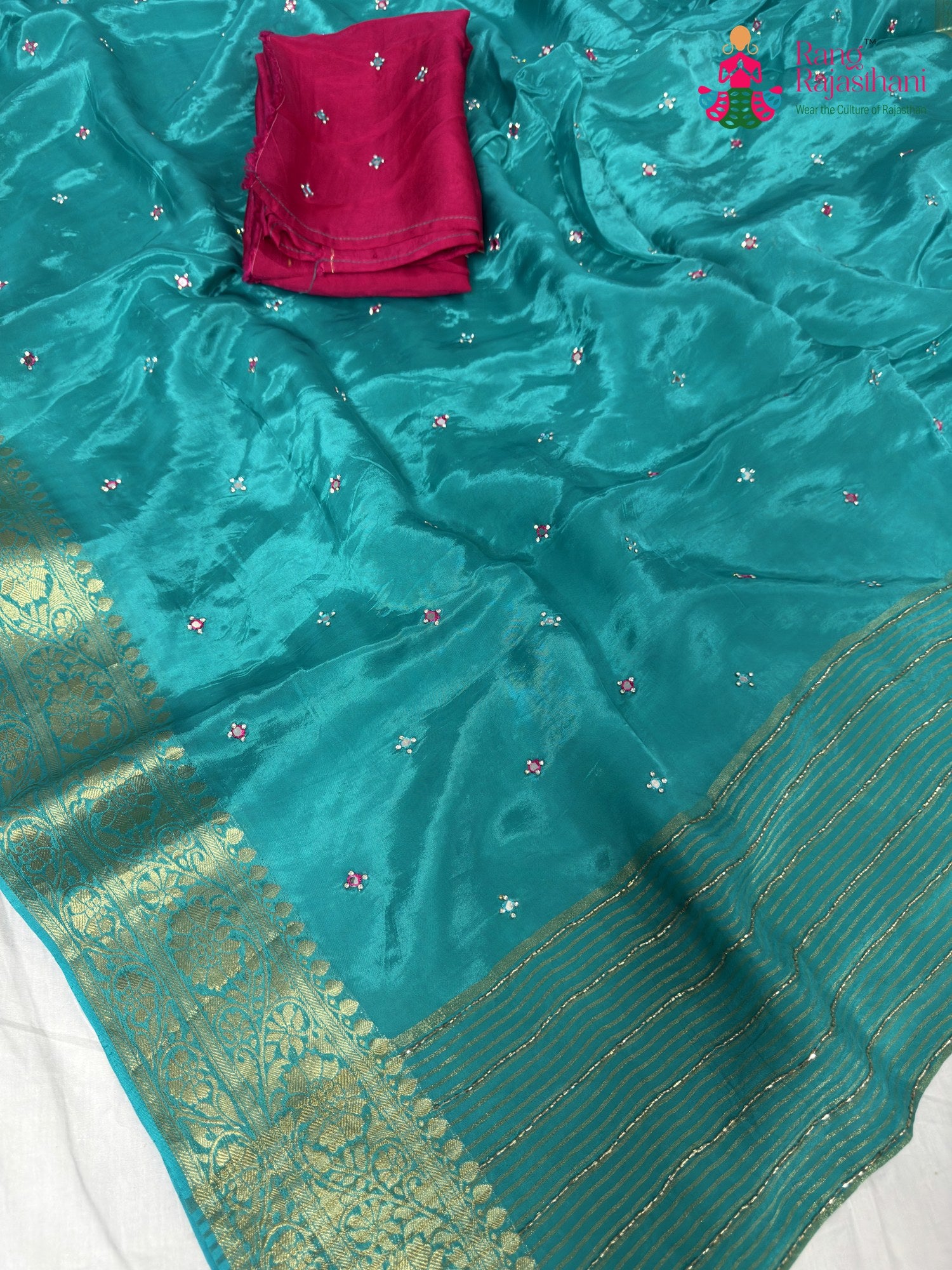 fabric texture of firozi pure ho silk mirror saree