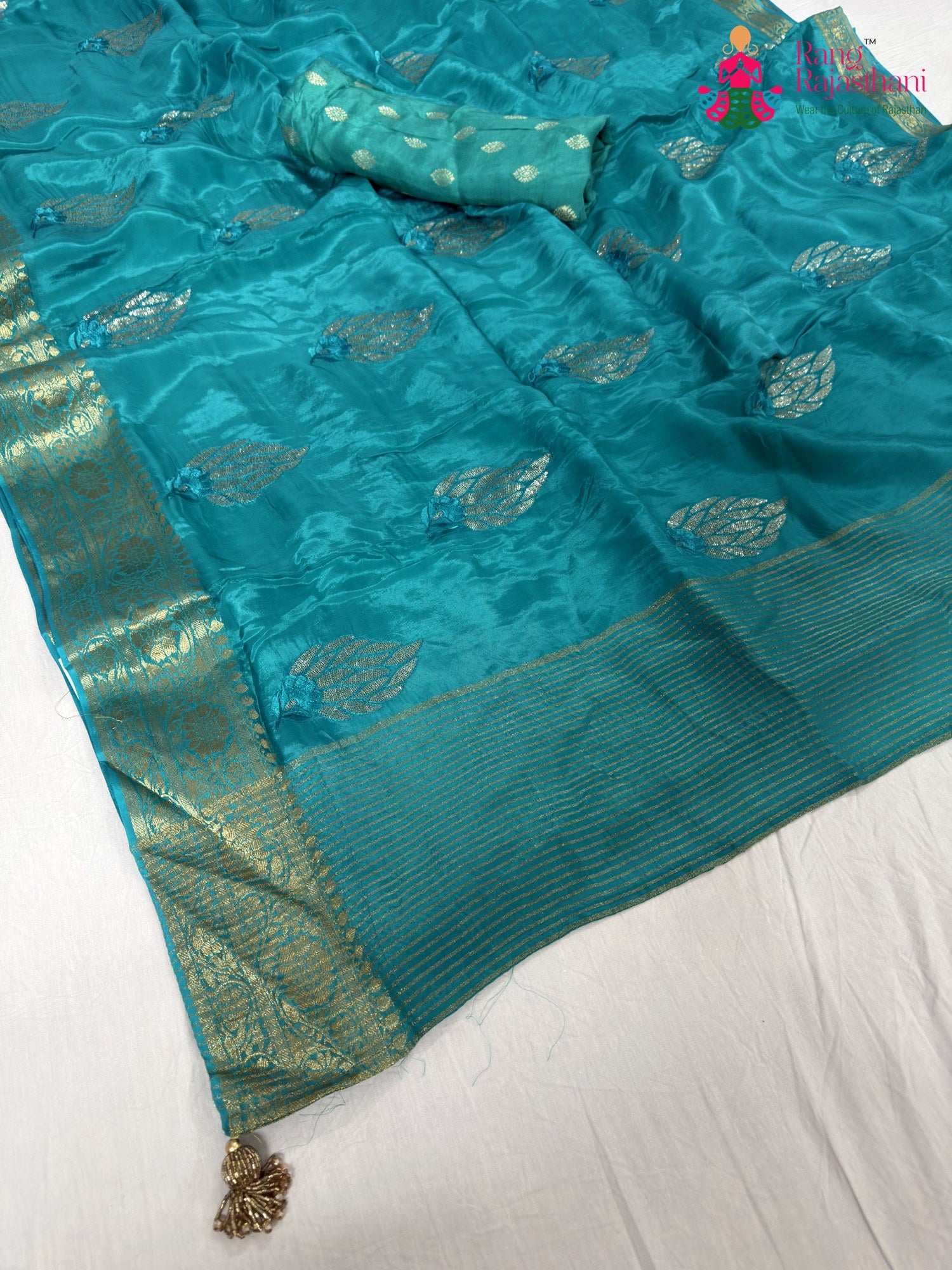 pallu detailing of firozi pure ho silk sequin saree