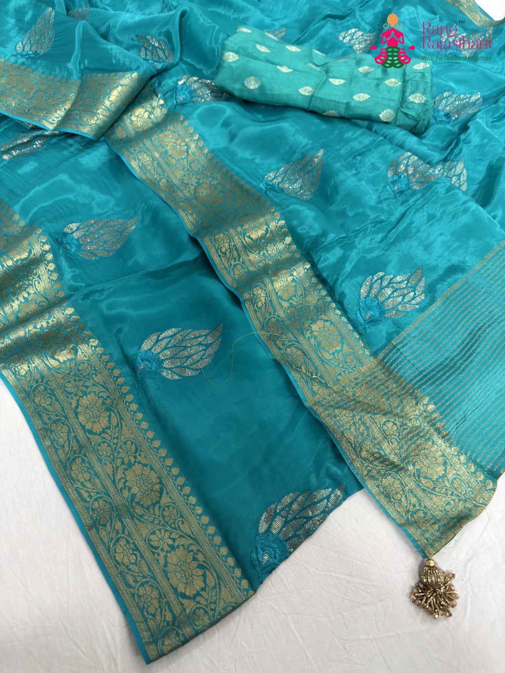 border detailing of firozi pure ho silk sequin saree