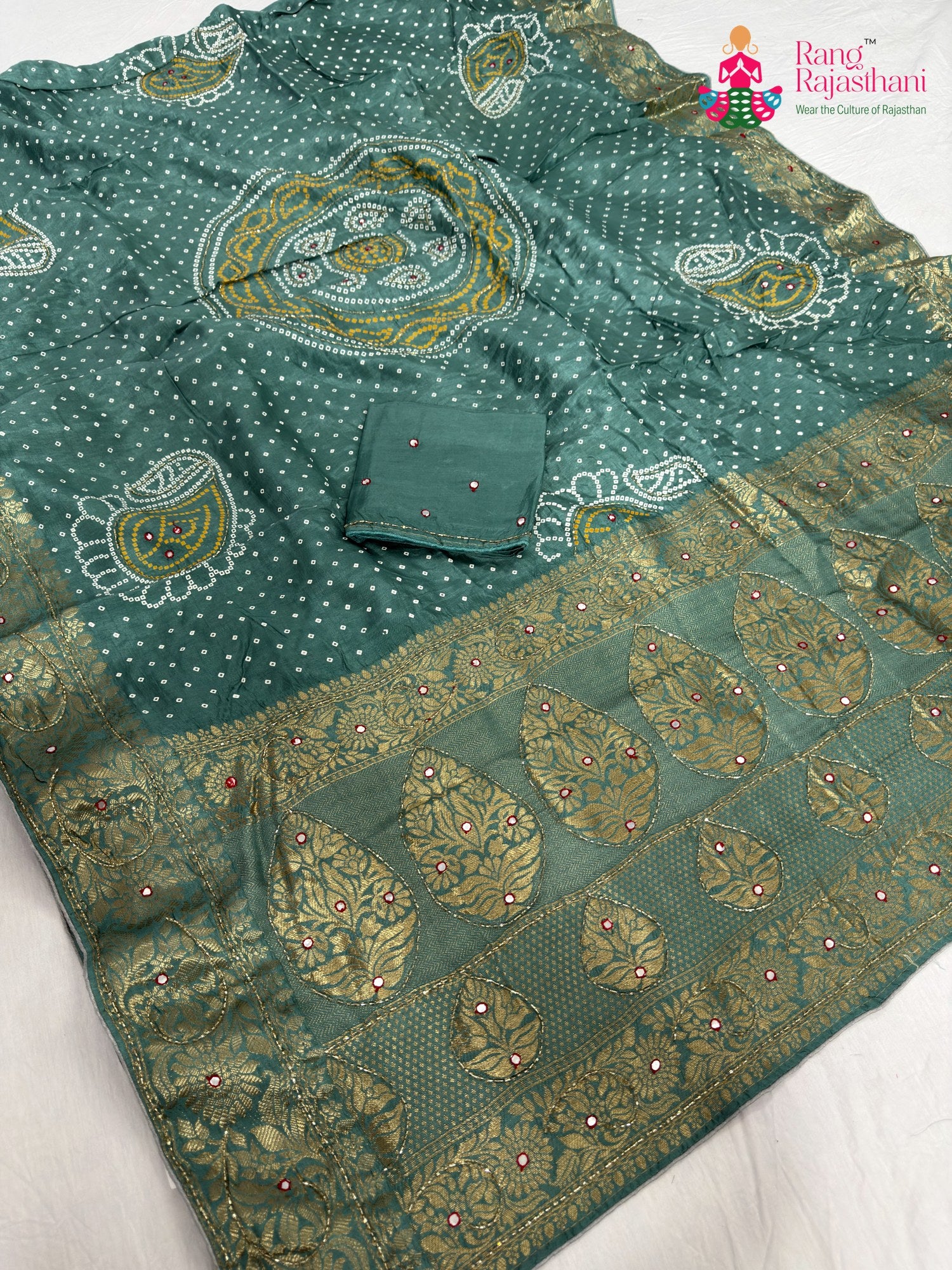 close up detailing of firozi pure russian silk bandhani saree