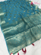 close up detailing of firozi soft georgette banarasi zari weave saree