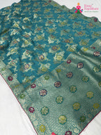 pallu detailing of firozi soft georgette meenakari zari saree