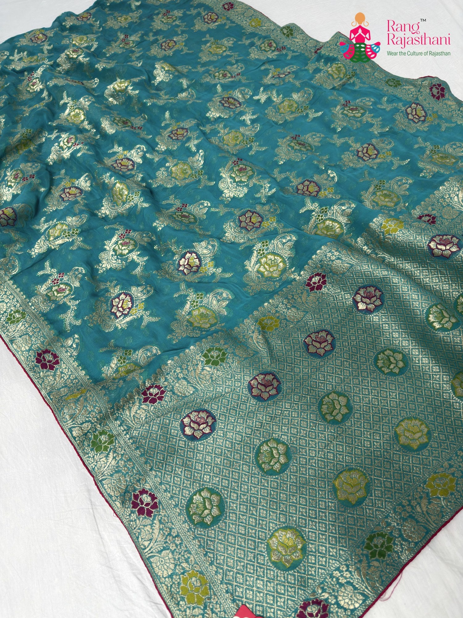 pallu detailing of firozi soft georgette meenakari zari saree