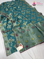 close up detailing of firozi soft georgette meenakari zari saree