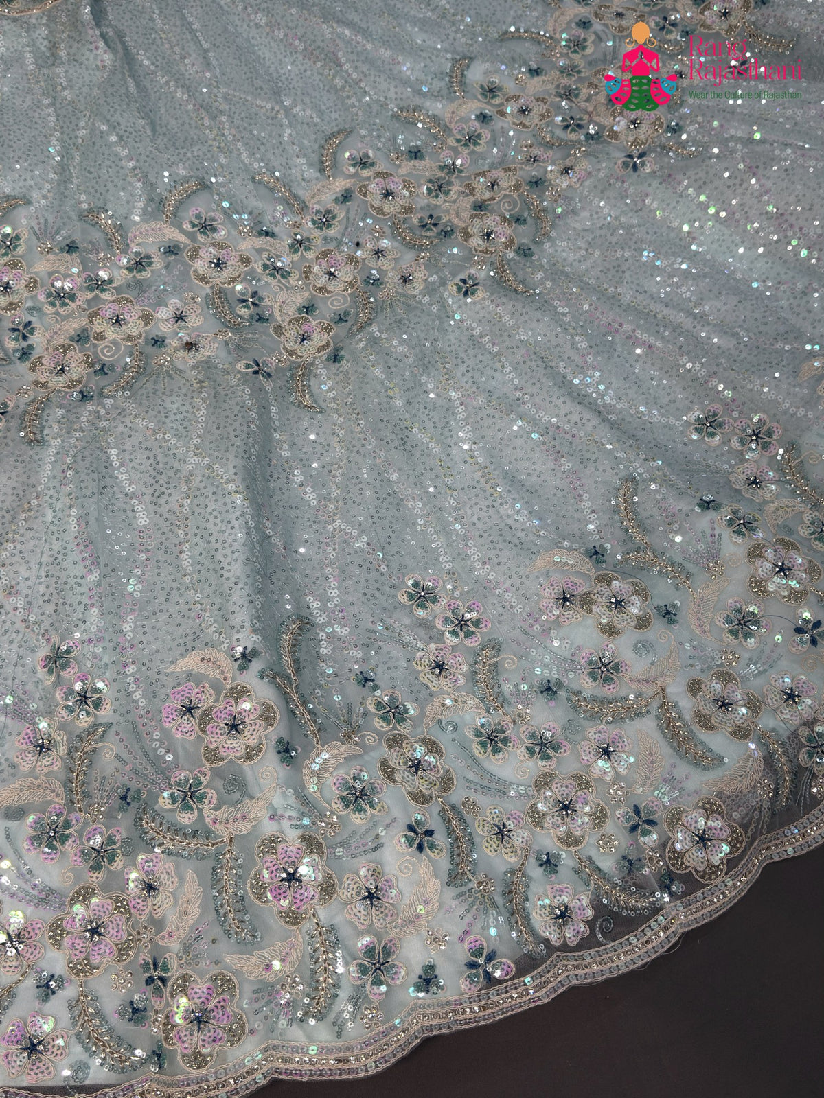 lehenga flare detailing of firozi synthetic sequin saree