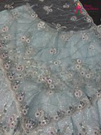 chunni detail of firozi synthetic sequin saree
