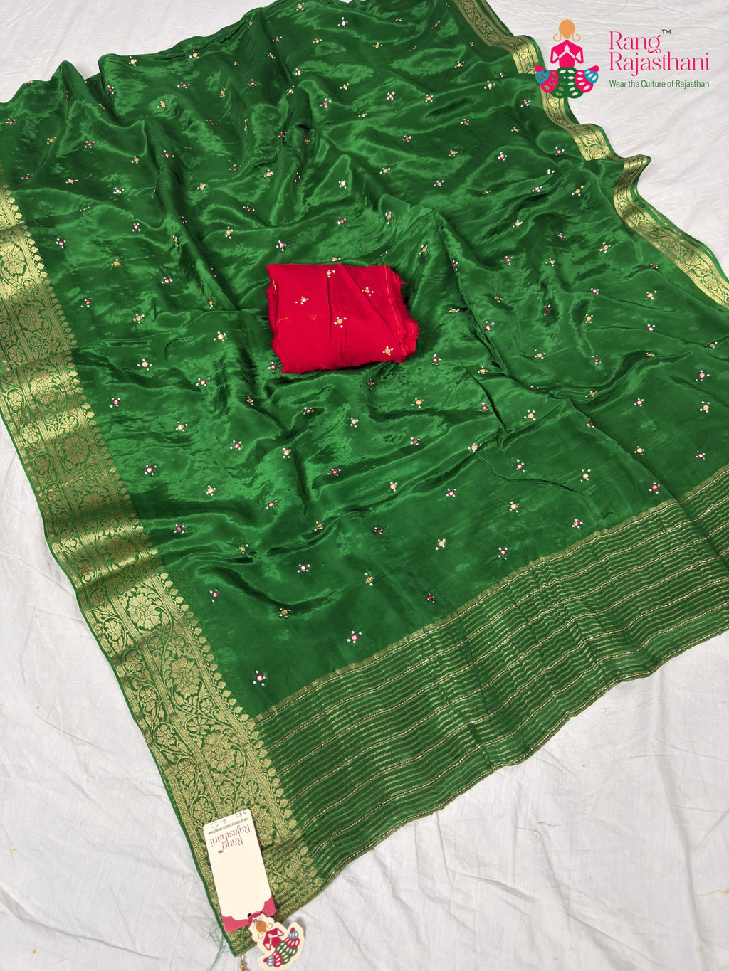 border detailing of graceful green silk saree