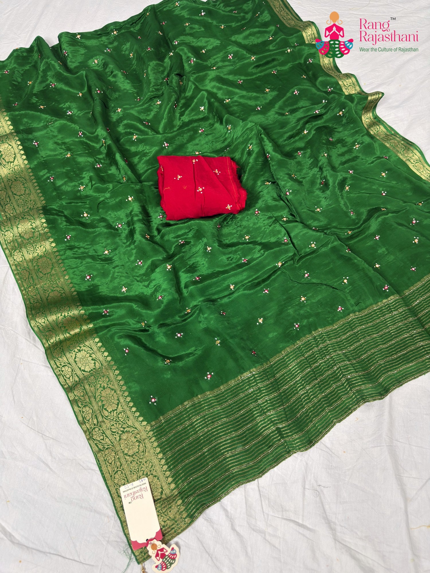 border detailing of graceful green silk saree