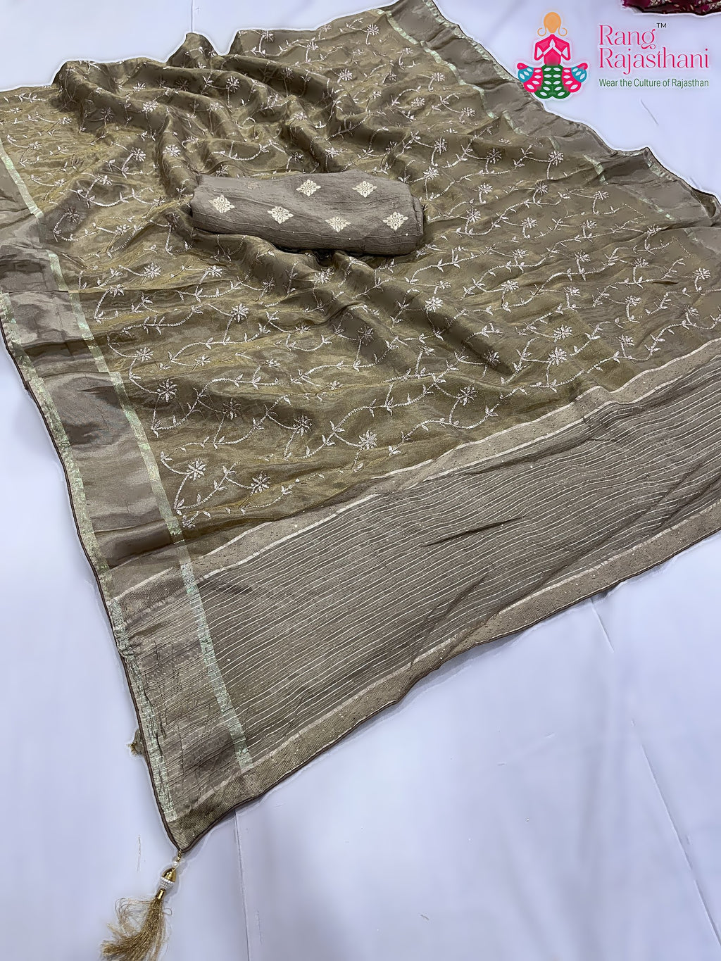 pallu detailing of gray pure tissue silk zari embroidery saree 