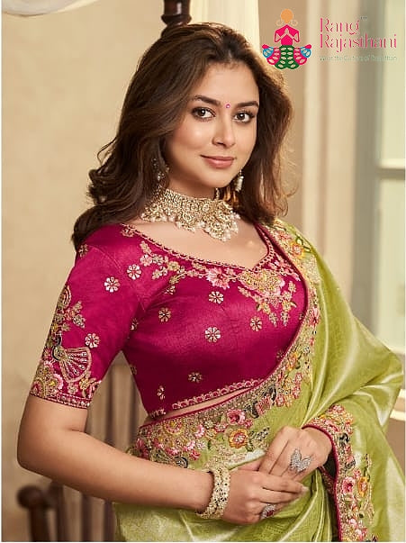 close up detailing of green art silk zari embroidery saree 