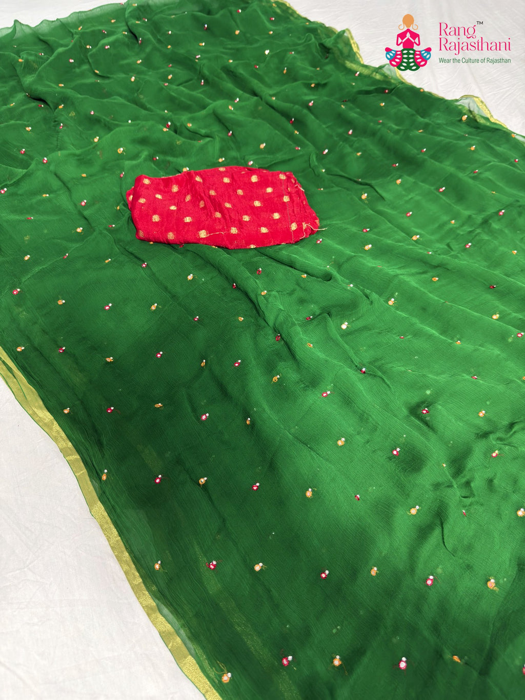 close up detailing of green chiffon mirror saree