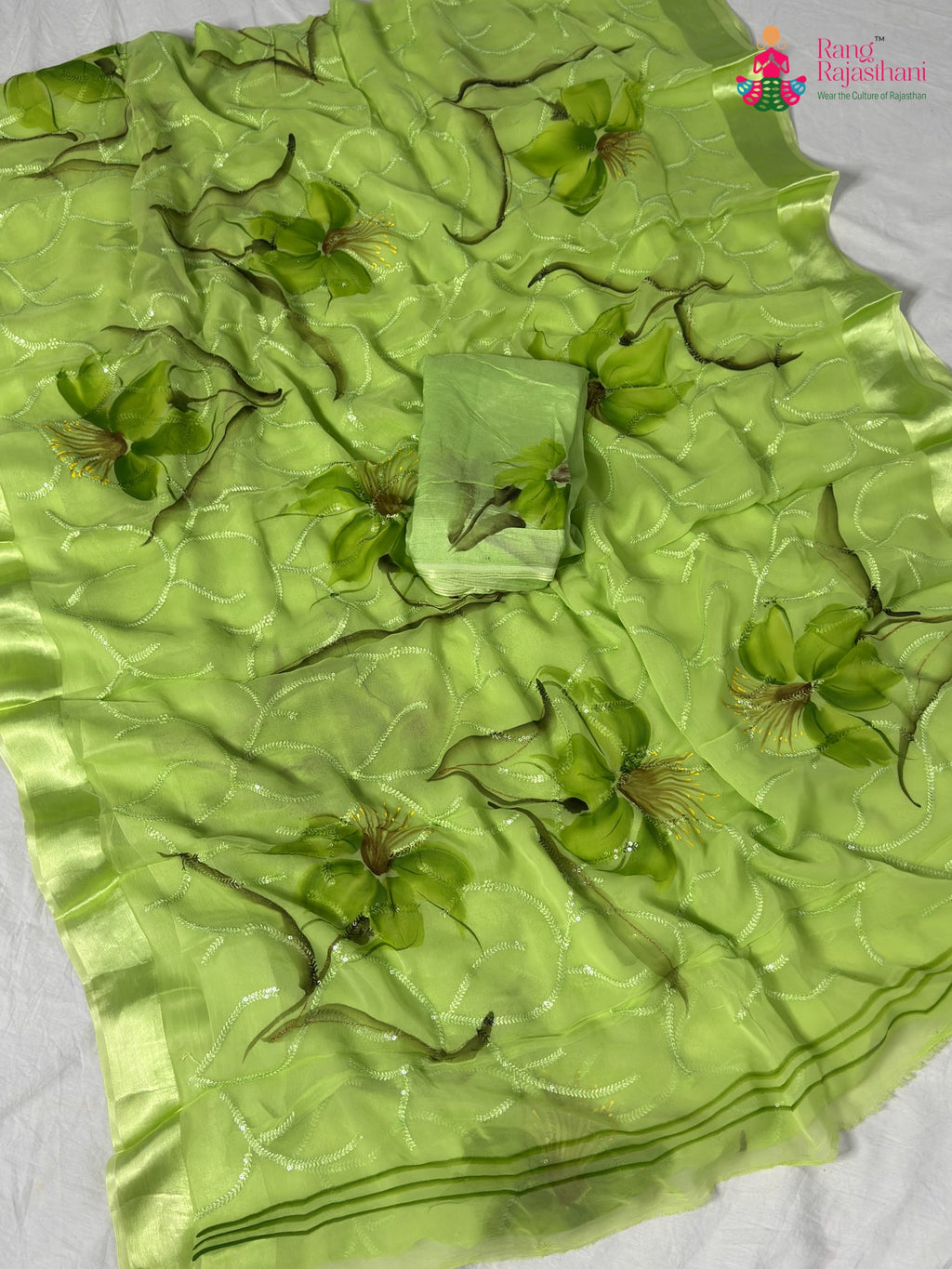 close up detailing of green chiffon resham embroidery saree