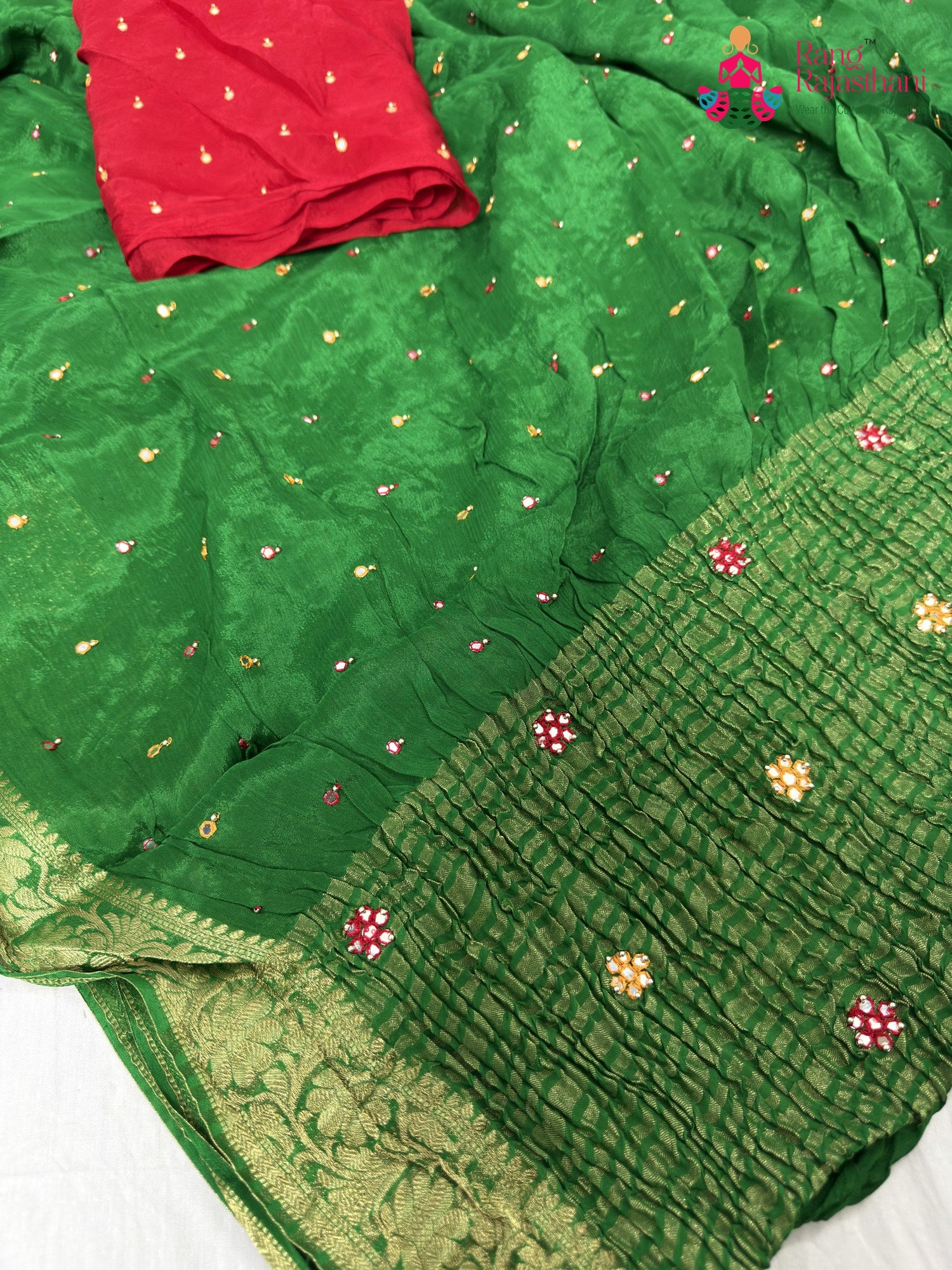 pallu detailing of green chinnon banarasi zari weave saree