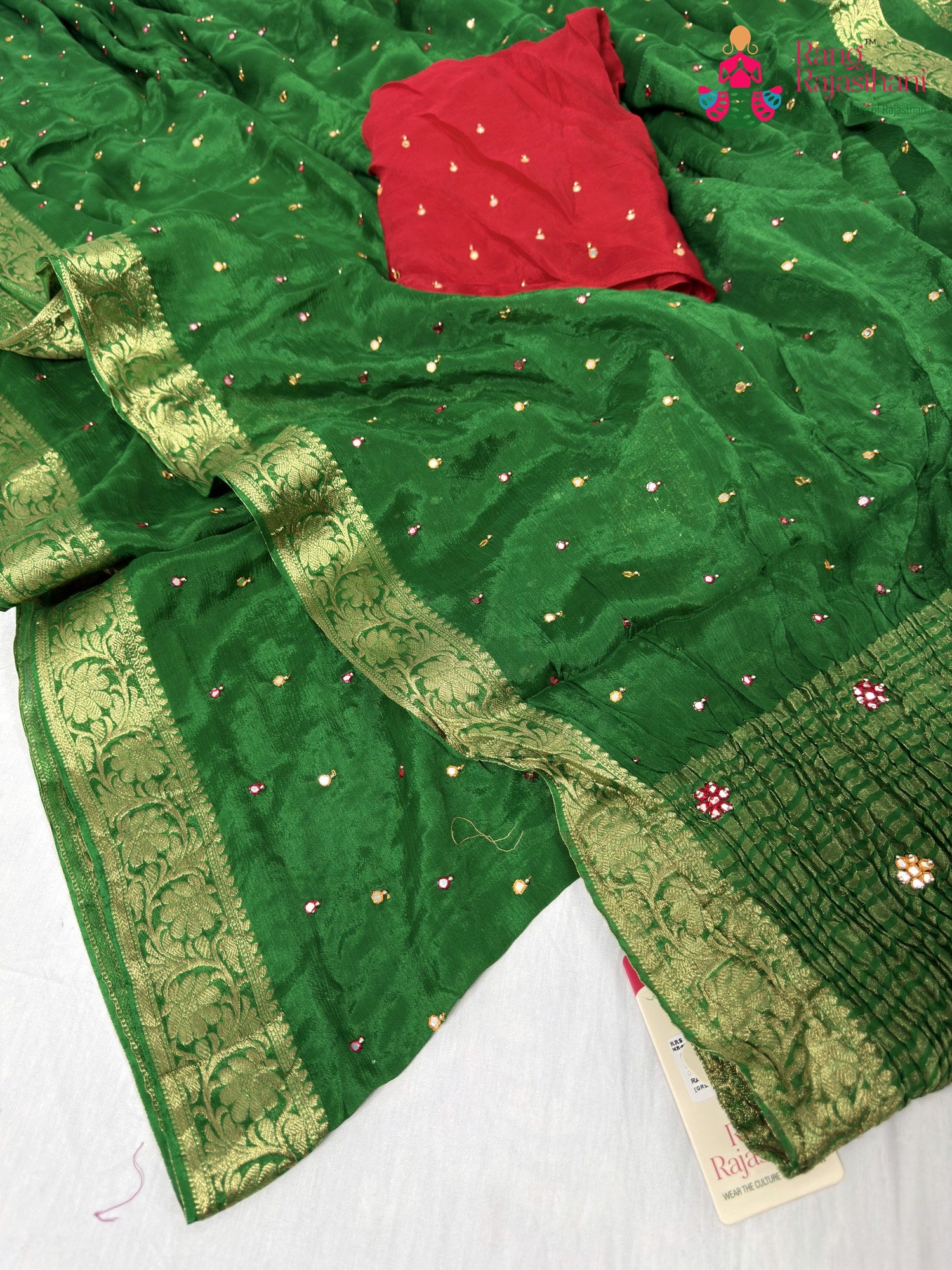 border detailing of green chinnon banarasi zari weave saree