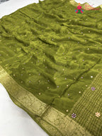pallu detailing of green chinnon banarasi zari weave saree