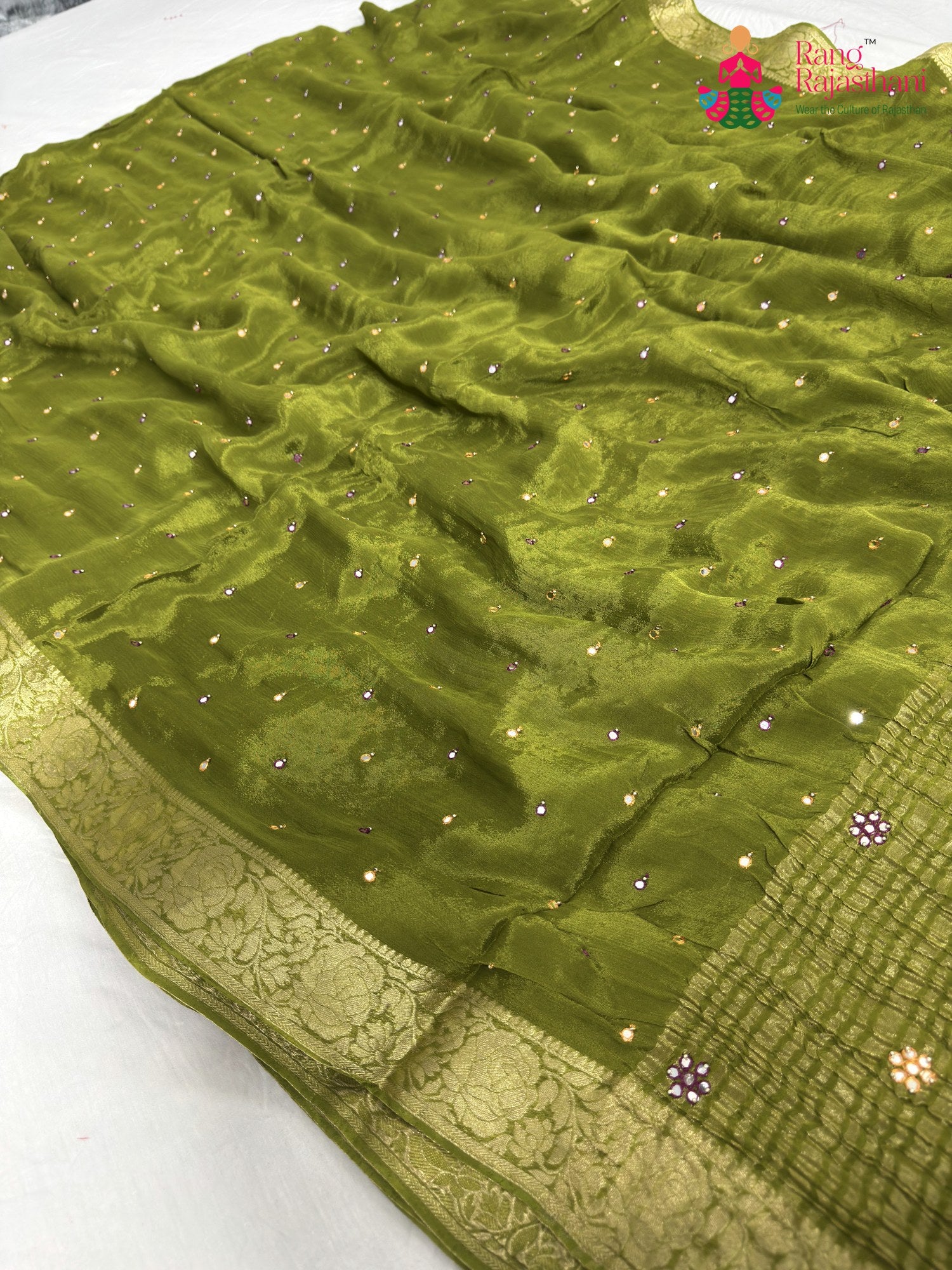 pallu detailing of green chinnon banarasi zari weave saree