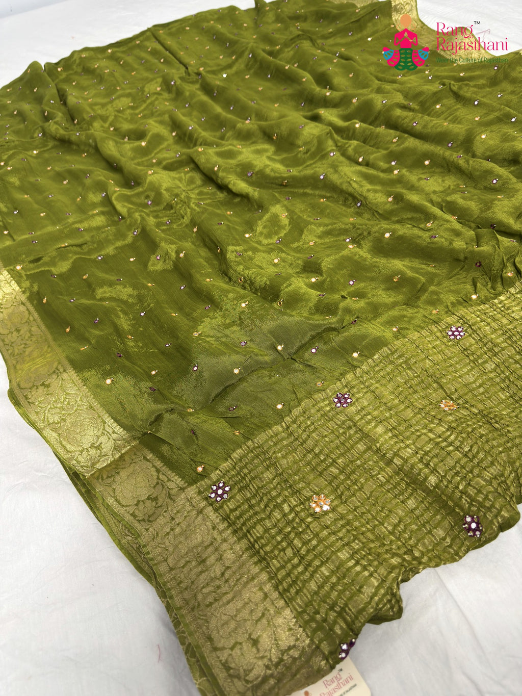close up detailing of green chinnon banarasi zari weave saree