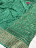 pallu detailing of green chinnon jacquard weave saree