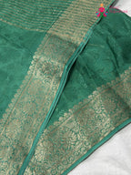 close up view of green chinnon jacquard weave saree