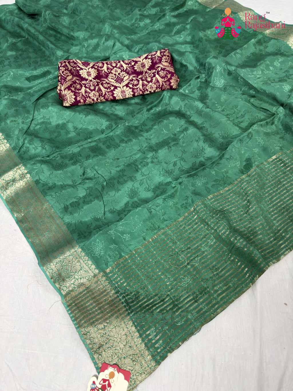 pallu detailing of green chinnon jacquard weave saree