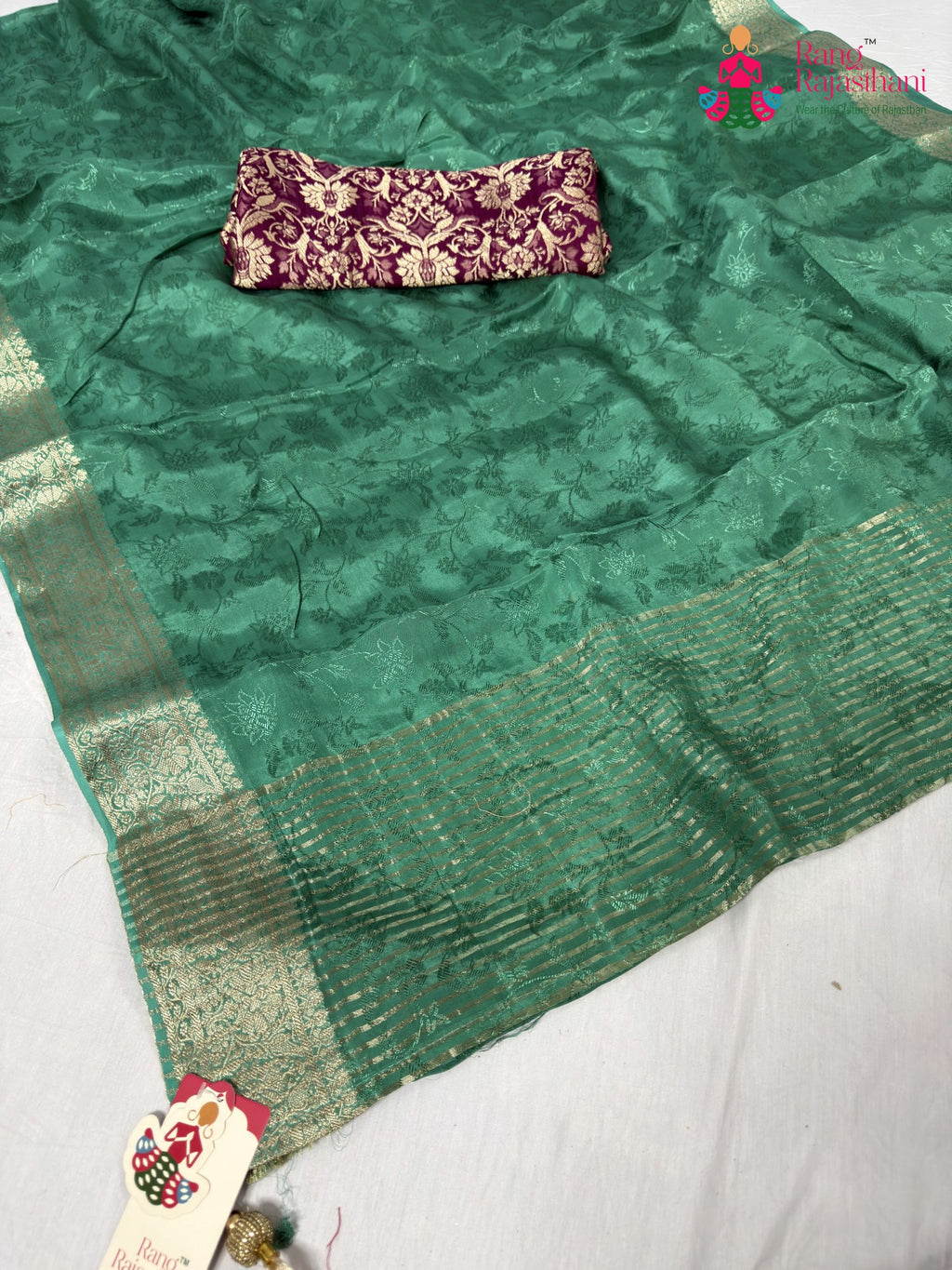 close up detailing of green chinnon jacquard weave saree