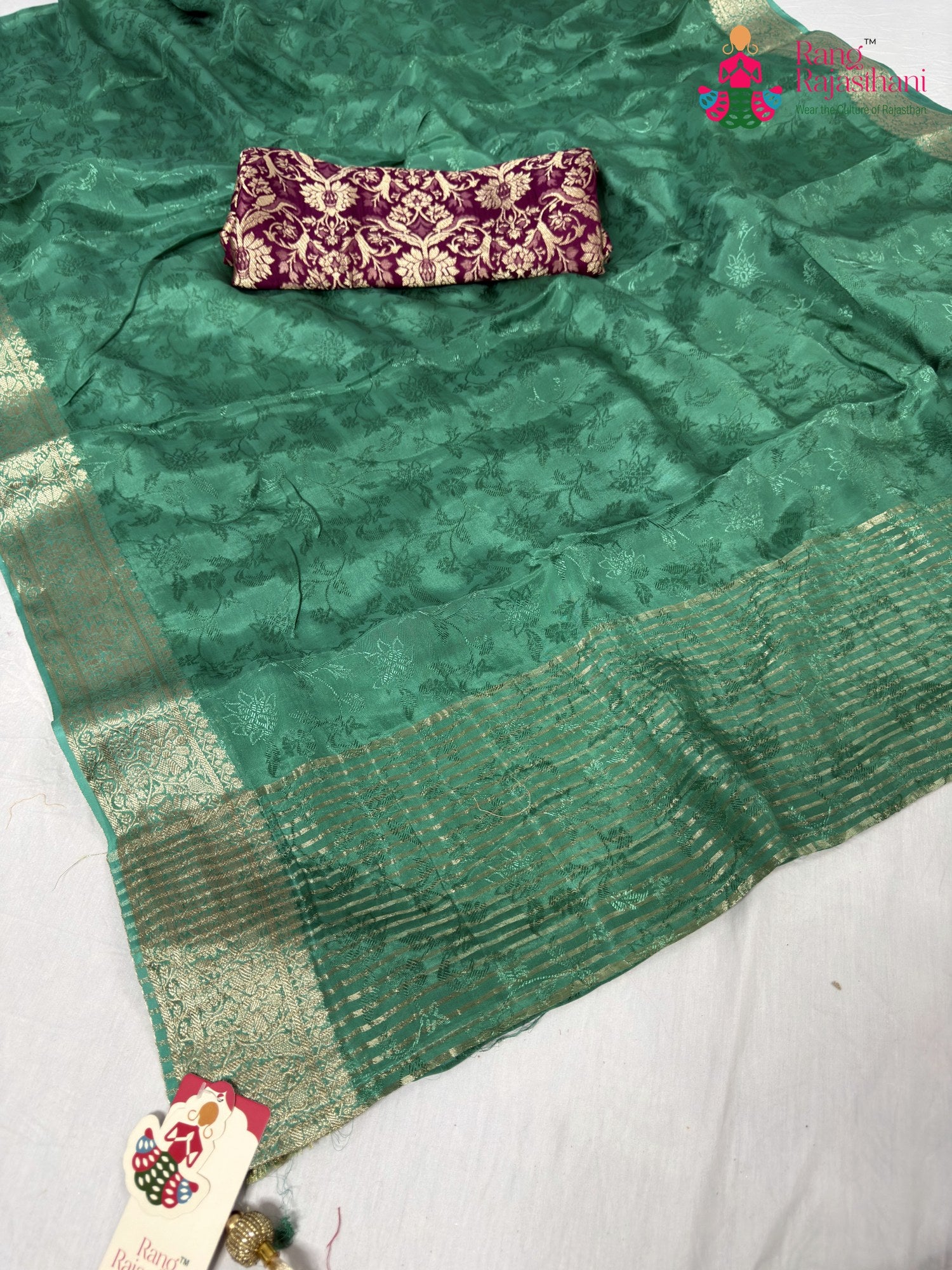 close up detailing of green chinnon jacquard weave saree