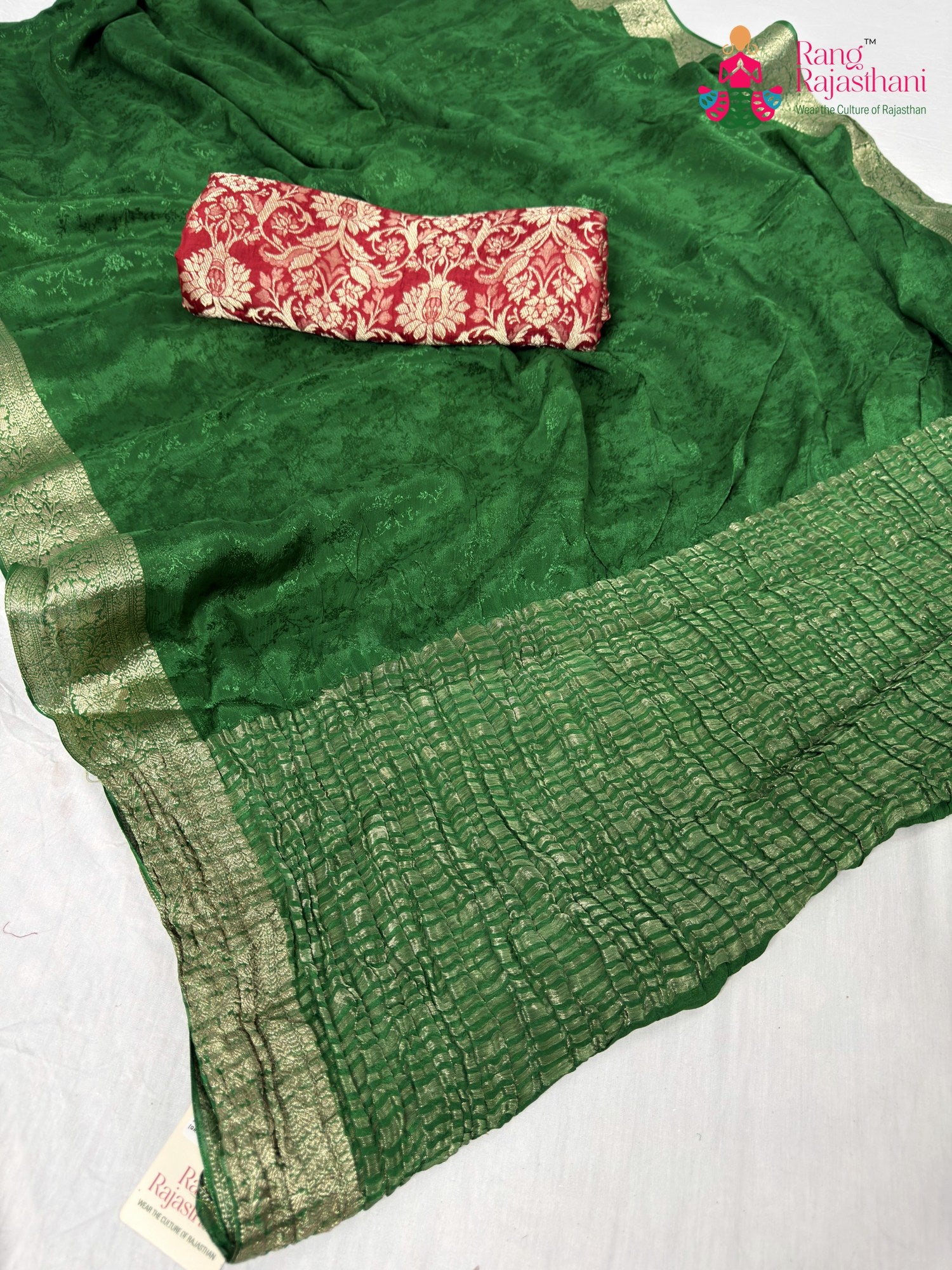 pallu detailing of green chinnon jacquard weave saree