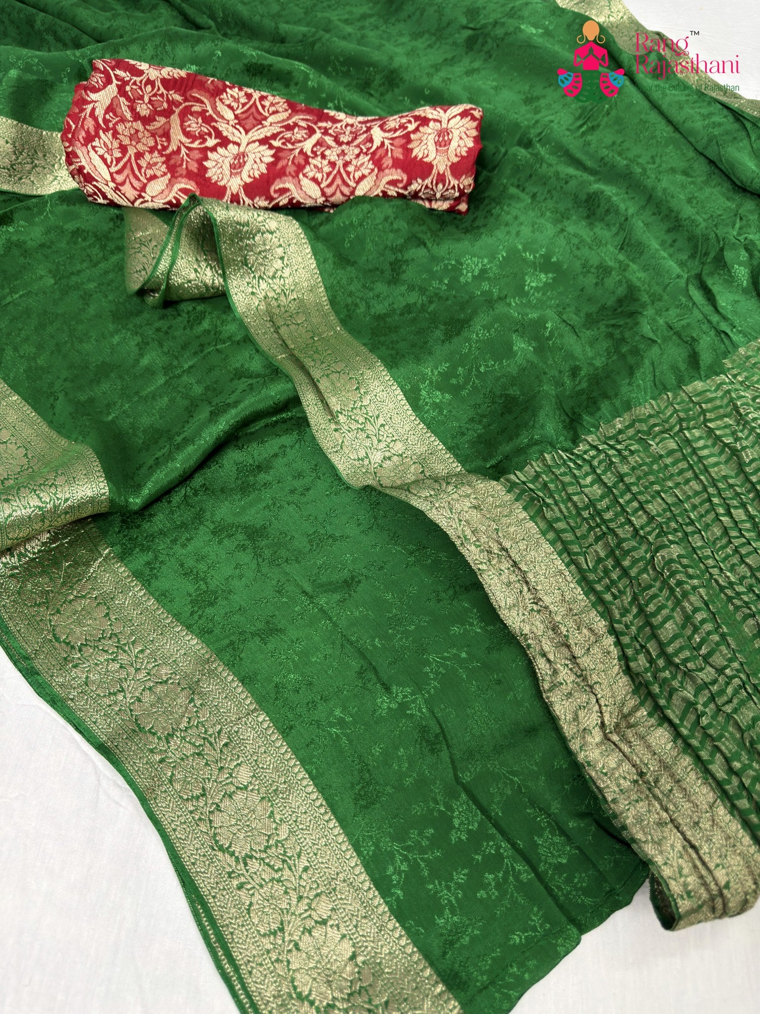 border detailing of green chinnon jacquard weave saree