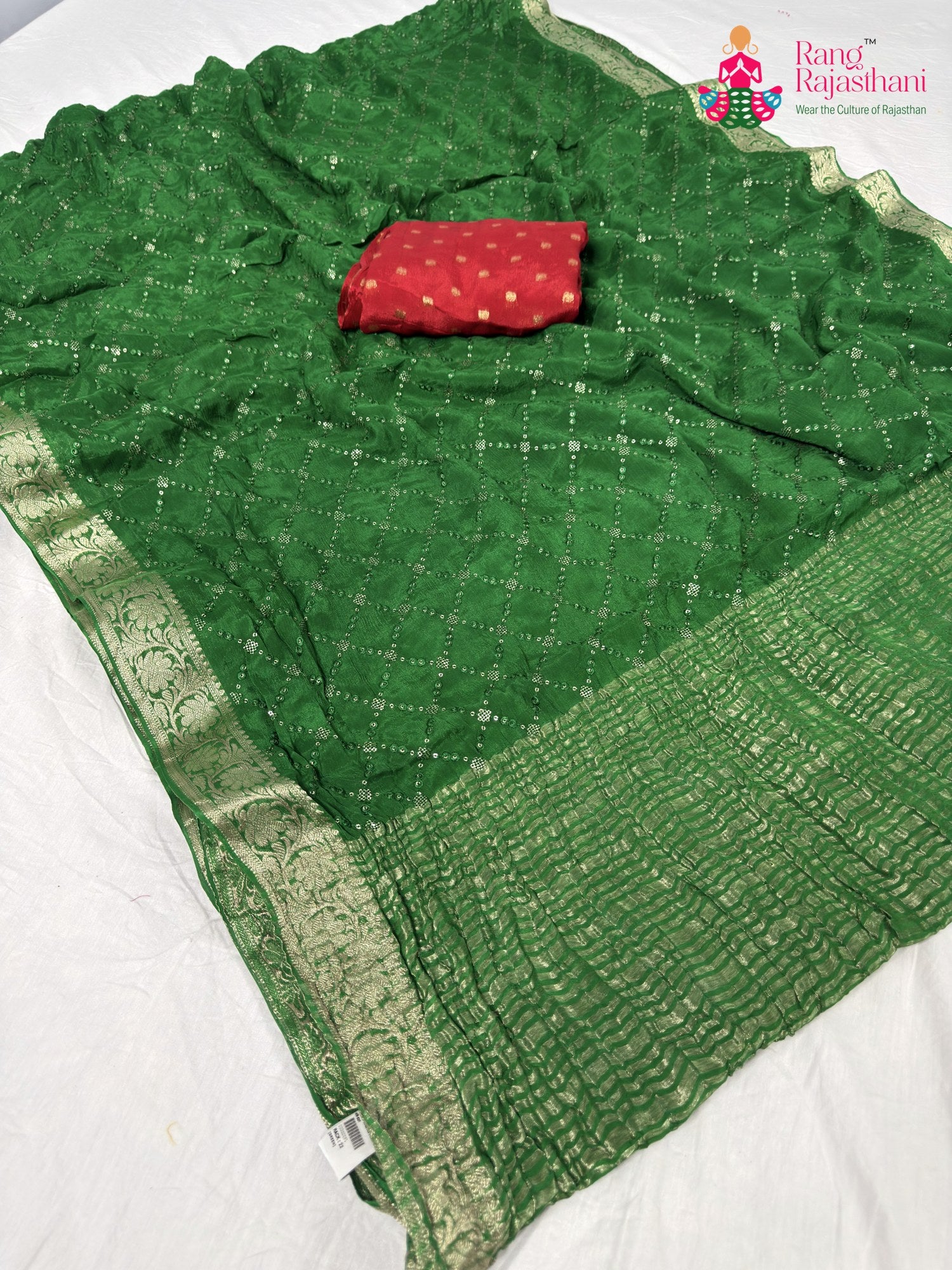 pallu detailing of green chinnon sequin saree