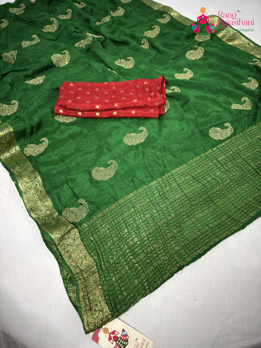 close up detailing of green chinnon zari embroidery saree