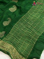 pallu detailing of green chinnon zari embroidery saree