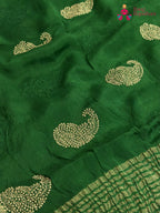 design pattern of green chinnon zari embroidery saree