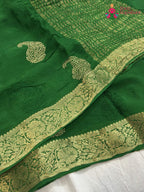 close up view of green chinnon zari embroidery saree