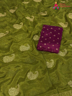 pallu detailing of green chinnon zari embroidery saree