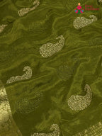 design pattern of green chinnon zari embroidery saree