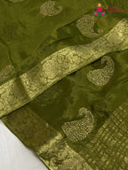 close up view of green chinnon zari embroidery saree