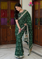 Dark Green Soft Synthetic Silk saree with Zari Work and Figure Work side drape view