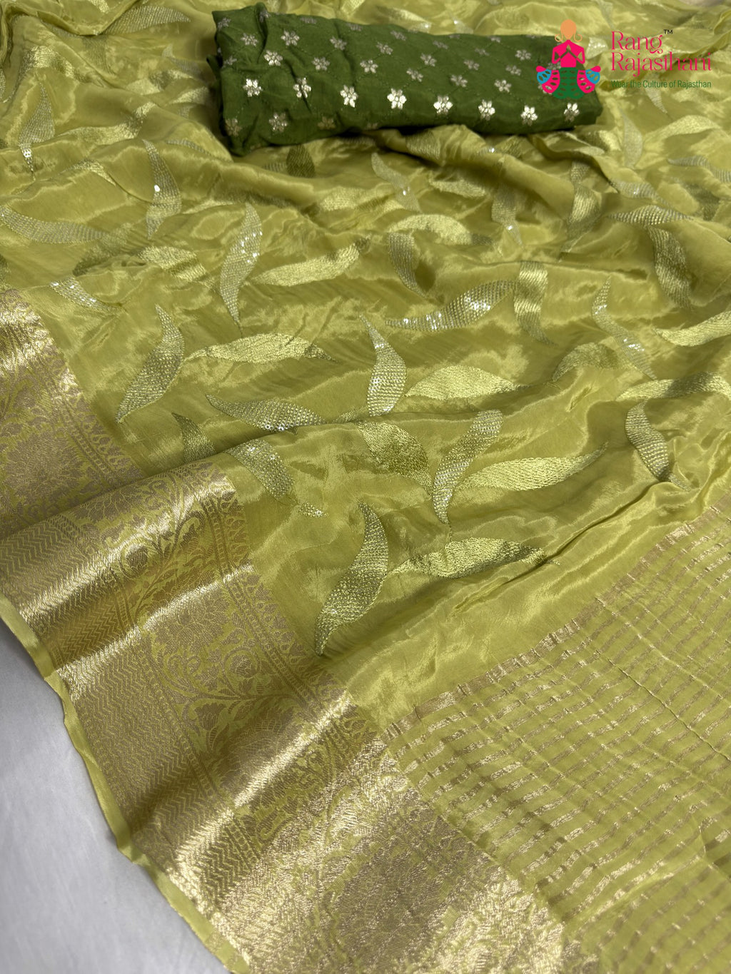 close up detailing of green pure ho silk sequin saree