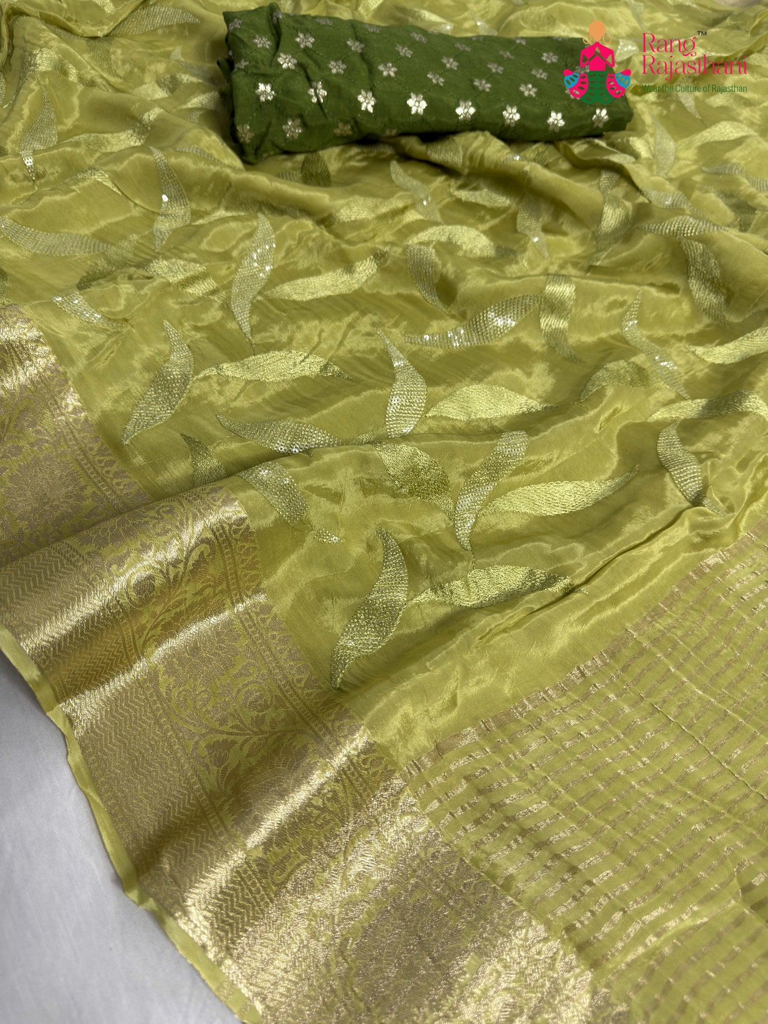 close up detailing of green pure ho silk sequin saree