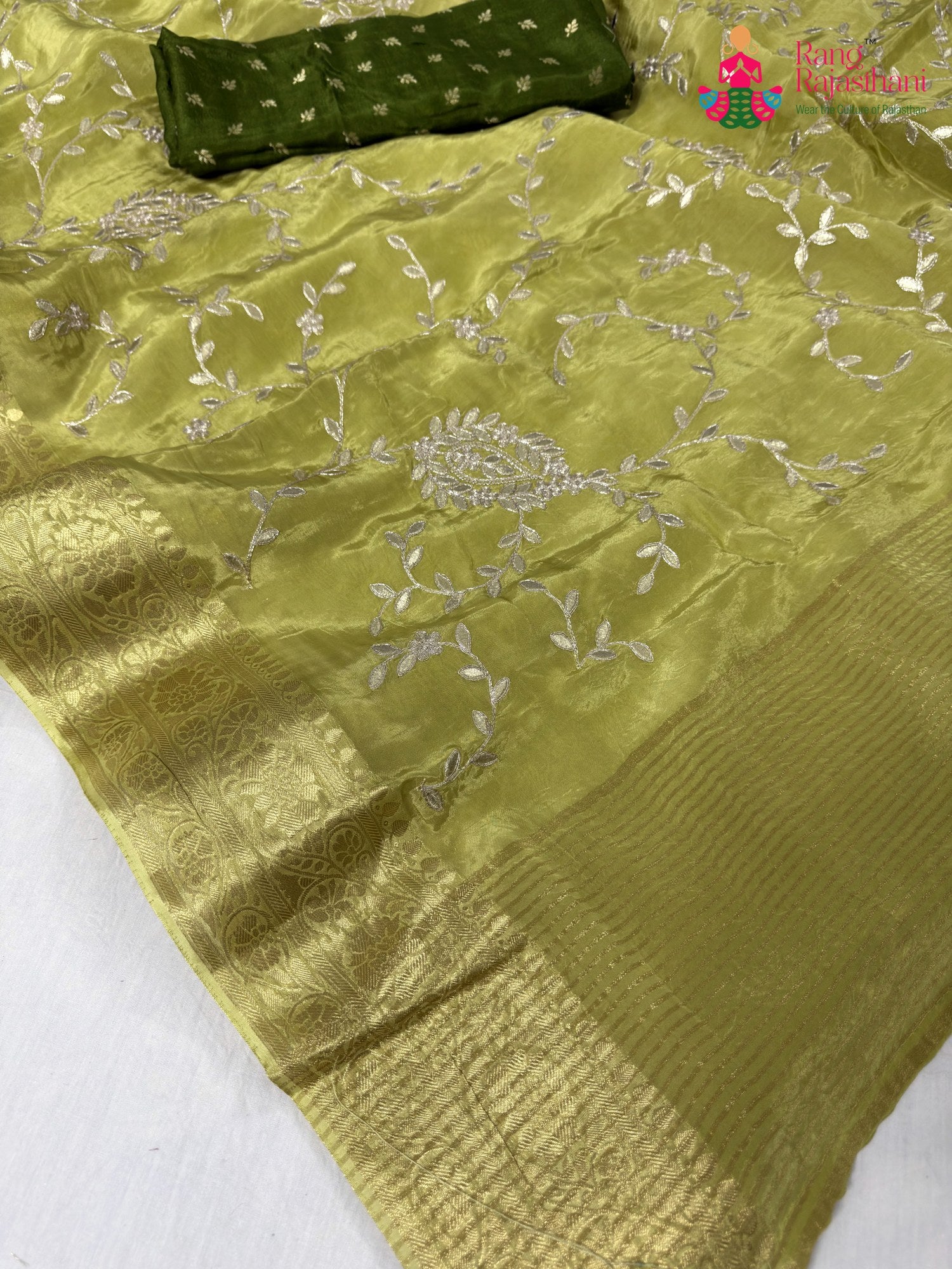pallu detailing of green pure ho silk zari embroidery saree