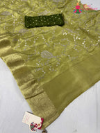 close up detailing of green pure ho silk zari embroidery saree
