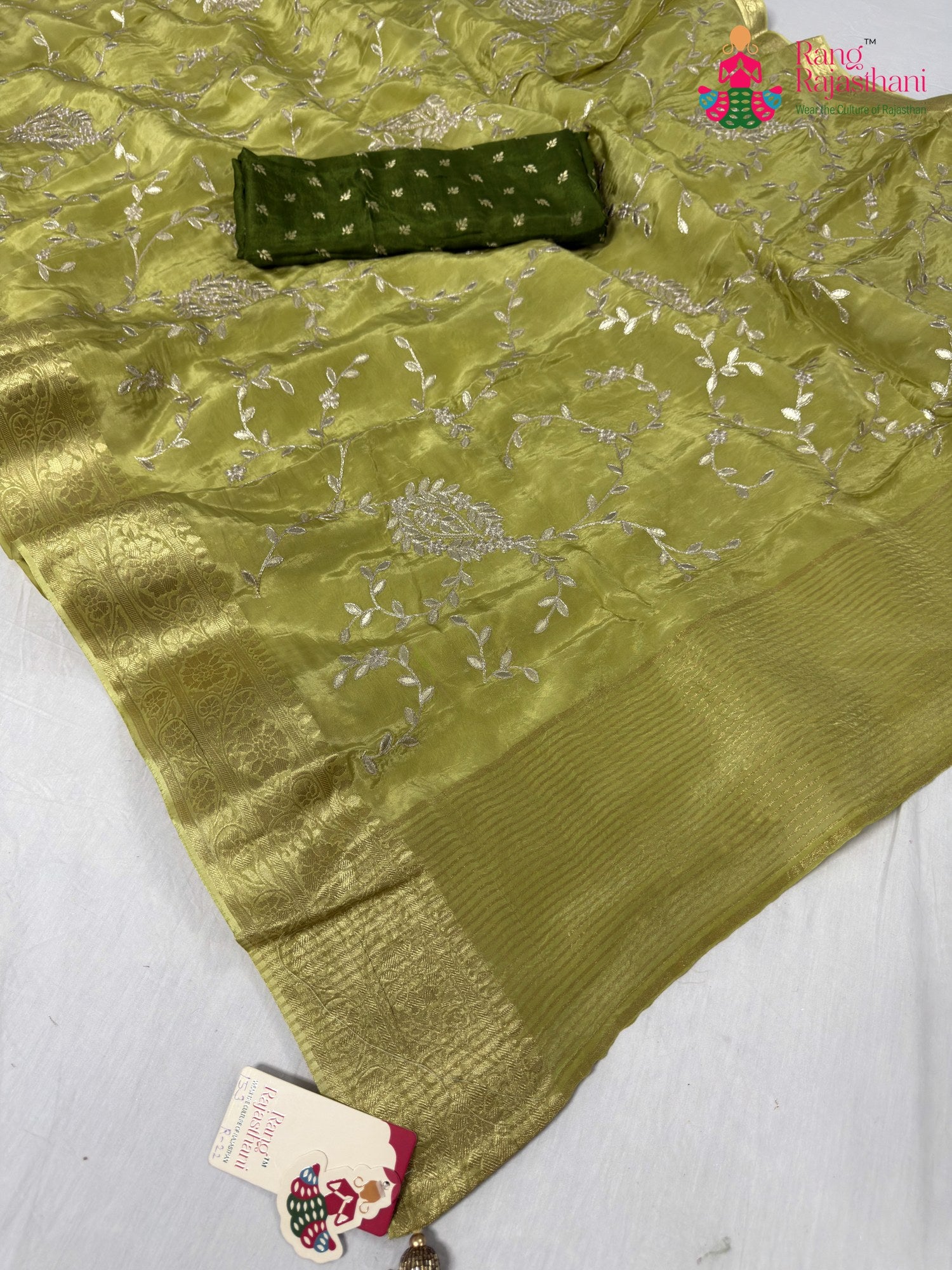 close up detailing of green pure ho silk zari embroidery saree