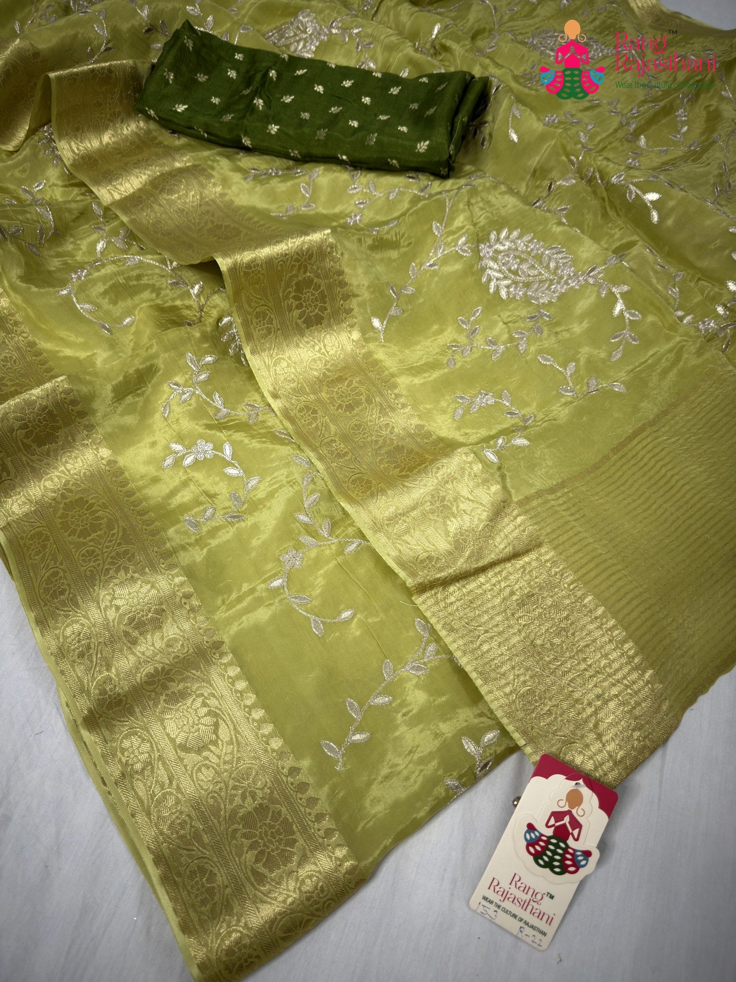 border detailing of green pure ho silk zari embroidery saree