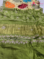 close up detailing of green pure modal silk gota patti saree 